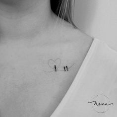 a black and white photo of a woman's chest with two birds on it