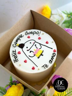 there is a cake in the box that says happy campe gupo on it