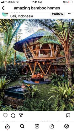 an outdoor hot tub in the middle of some plants and trees with people sitting on it