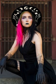 *due to printing there might be slight placement differences than pictured. A sturdy thick 100% polyester hat. I have applied moons and a cosmic theme in white. Get your witchy vibe on. It has adjuster inside. Size S/M 22.3 inch circumference  Size M/L 22.8 inch circumference and 3.25 inch brim. Has inside adjuster. Gothic Hat For Halloween, Gothic Hat For Halloween And Alternative Fashion, Mystical Halloween Costume Hats And Headpieces, Gothic Halloween Hat For Alternative Fashion, Mystical Halloween Festival Costume Hats And Headpieces, Witchy Hat With Curved Brim, Black High Crown Hat For Alternative Fashion, Black Top Hat For Halloween Alternative Fashion, Black Witchy Hat With Curved Brim