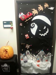 a door decorated for halloween with decorations on it