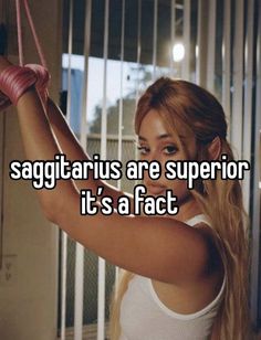 a girl with long hair holding a pair of shoes in her hand and the caption says, sagittarus are supervisor it's a fact