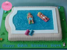 a birthday cake with two people floating in a pool