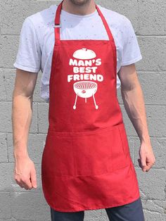 a man wearing an apron with the words man's best friend printed on it