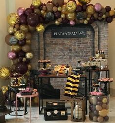 a room filled with lots of balloons and tables in front of a sign that says flataroma 94