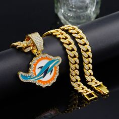 Material: Zinc Alloy Color: Gold Size: Chain Circumference 50cm, Pendant Length 5.4cm, Width 4.2cm Beautiful And Classic, Suitable For Both Men And Women Brand New And Fashionable, Very Popular Among Young People Brand New And Unused, Please Like If You Like It, Welcome To Quote, I Will Give You The Lowest Price Nfl Miami Dolphins, Cuban Chain Necklace, Diamond Bling, Rugby Team, People Brand, African Print Fabric, Miami Dolphins, Cuban Chain, Men's Jewelry