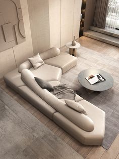 a modern living room with white leather furniture