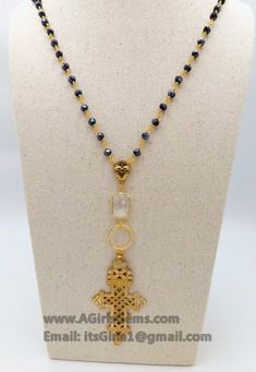 Brass Gold Coptic Cross Necklace, Long Black Rosary Chain Fashion Necklace, Ethiopian Cross Necklace, Beaded Rosary Chain Necklaces By Regina Harp Designs. D E T A I L S: Cross necklace in Picture #1 MA T E R I A L S: * Black Mystic AB Crystal Rosary in 22 k Gold plated wire wrapped 6 mm rondelle glass crystal beads. * Highest quality Gold Filled jump rings. Includes clear connector in rectangle shape. * 16 k Brushed Gold plated ring and Our Most Sacred Heart in Gold Pewter Center. L E N G T H: Black Mystic, Black Rosary, Ethiopian Cross, Rosary Chain Necklace, Coptic Cross, Beaded Rosary, Chain Fashion, Rosary Chain, Rosary Beads