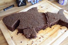 two pieces of chocolate cake on a cutting board