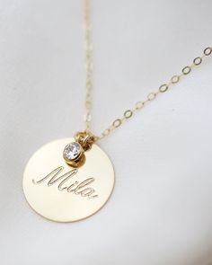 Have this custom necklace personalized with your child's name, your name, initialsor any meaningful word of your choice.This necklace is perfect for a special meaningful keepsake gift for mom, friendwife or that special someone. Gold filled or Sterling Silver Disc charm measures 19mm in diameter Cubic Zirconia measures approc. 4mm Necklace For Mom Personalized, Customized Necklace Names, Personalized Necklace Names, Name Necklace Gold Personalized Jewelry, Personalized Jewelry For Mom, Personalized Gold Necklace, Creative Jewelry Photography, Necklace For Mom, Custom Jewellery