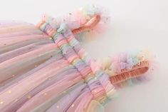 Rainbow Unicorn Tulle Princess Dress: Enchanting Elegance for Your Little One Elevate your baby's style with our enchanting Rainbow Unicorn Tulle Princess Dress. Crafted with a touch of magic and a dash of cuteness, this dress is perfect for the little princess in your life. Let your baby shine in the ethereal beauty of this summer-perfect outfit. Key Features: Material: Polyester, Viscose Style: Cute Season: Summer Age: 9M-5Y Baby Collar: O-Neck Material Composition: Polyester Sleeve Length(cm): Sleeveless A Whimsical Wonderland of Style: Transport your little one to a whimsical wonderland with the Rainbow Unicorn Tulle Princess Dress. The cute and stylish design is perfect for creating magical memories during the warm summer days. Premium Polyester and Viscose Blend: Made with a blend of Cute Tulle Fairy Dress With Ruffles, Playful Pink Tulle Fairy Dress, Whimsical Tulle Fairy Dress With Ruffles, Playful Tulle Fairy Dress With Ruffles, Multicolor Tulle Fairy Dress For Summer, Playful Pink Ruffled Fairy Dress, Multicolor Sweet Tutu Dress For Summer, Pink Tulle Tutu Dress For Playtime, Sweet Multicolor Tutu Dress For Summer