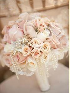 a bridal bouquet sitting on top of a chair