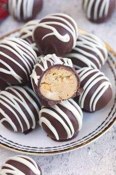 several chocolate covered desserts on a plate