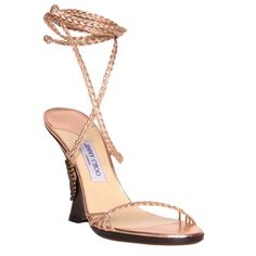 Metallic Pink Copper Color Leather Braided Sandals With Open Front And Lace Up Ankle Long Straps. The Dark Brown Wood Wedges Are Enriched By A Bronze Medallion And The Copper Leather Strings Before They Braid. Vero Cuoio. Made In Italy. Heel 4.75". Luxury High Heel Wedge Sandals With Wrapped Heel, Luxury Wedge Sandals With Wrapped High Heel, Luxury Wedge Sandals With Wrapped Heel, Luxury Wrapped Heel Wedge Sandals, Luxury Wedge Sandals With Wrapped Heel And Ankle Strap, Luxury High Heel Wedge Sandals With Heel Strap, Luxury Evening Wedge Sandals For Summer, Luxury Open Heel Wedge Sandals For Beach, Luxury Summer Wedge Sandals With Wrapped Heel