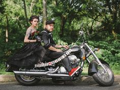 a man and woman dressed up as brides on a motorcycle in front of some trees