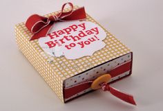 an open birthday card box with a red ribbon on it and the words happy birthday to you