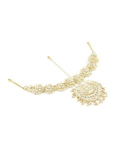 Welcome to Adornn Jewels Gold-plated white Kundan & Pearls Crescent Matha patti with hook closure Size & Fit Center Piece Tikka Length-16 cm Throughout Patti Length-30 cm Material & Care Material: Alloy Plating: Gold-plated Stone Type: Kundan Care instructions: Wipe your jewellery with a soft cloth after every use Always store your jewellery in a flat box to avoid accidental scratches Keep sprays and perfumes away from your jewellery Do not soak your jewellery in water Clean your jewellery using White Tikka With Intricate Design For Diwali, White Intricate Design Tikka For Diwali, White Bollywood Festival Jewelry, White Tikka For Reception And Festivals, White Bollywood Tikka For Reception, White Kundan Tikka With Motifs, White Tikka With Motifs For Diwali, Bollywood Style Embroidered Kundan Jewelry, White Bollywood Tikka With Motifs