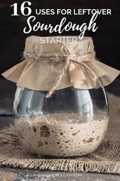 a glass jar filled with sand sitting on top of a table