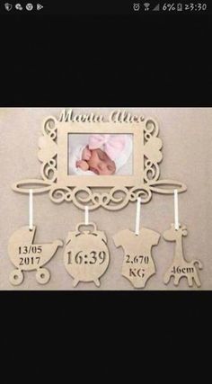 a baby's birth photo hanging on a wall with the name and number in it