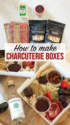 an open box filled with food on top of a white countertop next to bottles of wine