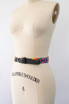 Vintage 80s multi-color genuine leather belt. Crafted from high-quality genuine leather, this classic piece features a geometric round design. Multi-color rainbow and black color. Silver-tone belt buckle. The measurements provided give a good idea of the fit, but please note that vintage sizing can vary, so it's always best to compare the measurements to a similar item in your own wardrobe to ensure a good fit.  * Brand: n/a * Decade: 1980s * Material: 100% Genuine Leather  * Color: Multi-Color Rainbow * Condition: Excellent vintage condition, minimal pre-wear; no visible flaws to note S I Z E + F I T * Full Length: 41" * Width: 1.25" * First Hole: 34" * Last Hole: 36" * Marked Size: Large * Estimated Size: large * Clipped-on Model for Visual Fit Reference Please review our shop policies, Fit Reference, Belt Vintage, Color Rainbow, Genuine Leather Belt, Round Design, Suspender Belt, Style Expert, Shop Policies, Belt Buckle