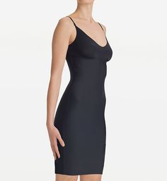 Enjoy a smoother silhouette under your favorite dresses with this sleek microfiber slip. Made of ultra-soft knit nylon, cotton and elastane. Flattering V-neckline has a laser-cut edge. Wireless cups have ruching along the bottom. Sewn-on elastic at inner base of cups keeps a close fit. Four-way stretch for a flexible, body-conforming fit. Sleek microfiber outside, comfy cotton on interior surface. Fabric offers light to moderate compression to smooth out bulges and ripples. Target areas: back, w Elegant Stretch Slip Dress With Built-in Bra, Fitted Slip Dress With Built-in Bra And Straight Neckline, Seamless Fitted V-neck Shapewear, Sleek Second-skin Shapewear With Built-in Bra, Elegant Second-skin Smoothing Shapewear, Elegant V-neck Stretch Shapewear, Sleek Sleeveless Smoothing Dress, Fitted Bias Cut Camisole Slip Dress, Elegant Seamless Elastane Shapewear