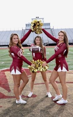 the cheerleaders are holding their pom poms