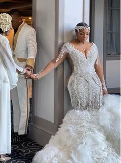 the bride and groom are getting ready to walk down the aisle