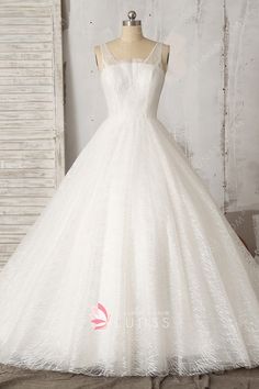 a white wedding dress on a mannequin