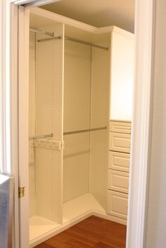 an empty walk in closet with shelves and drawers