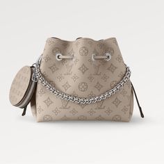 New Authentic Louis Vuitton Bella Bucket Bag In Gray Calf Leather With Perforated Monogram Pattern. Retail $4350+Tax 7.5 X 8.7 X 5.5 Inches (Length X Height X Width) Galet Gray Mahina Perforated Calf Leather Chain Handle Calf-Leather Trim Microfiber Lining Silver-Color Hardware Round Coin Purse Leather Drawstring To Secure Belongings 4 Protective Metal Bottom Studs Strap:Removable, Adjustable Strap Drop: 19.7 Inches Strap Drop Max: 22.0 Inches Handle:Single, Removable Dust Bag Included Original Monkey Bag, Round Coin Purse, Louis Vuitton Totes, Monogram Pattern, Lv Bag, Leather Chain, Black Tote Bag, Vuitton Handbags, Louis Vuitton Handbags