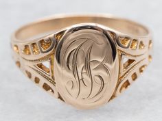 This signet ring features an elegant "JB" engraving, adding a personal touch to your style. Made of yellow gold, this ring is a timeless addition to any jewelry collection. Perfect for both formal events and everyday wear, it's a must-have for any fashion-forward individual! Please note that this signet ring has its original monogram. Unfortunately, this piece can only be altered with affecting the quality of the piece. Please feel free to contact us to help you find your perfect signet ring in your style and budget! Metal: 10K Yellow Gold Top Measurements: 9.6 x 14.1 mm, Oval Monogram: "JB" Engraved Ring Size: 12.25 mm Marks: "O101B" Stamped on the inside band SKU #: A43425 Each piece has been identified and graded by a Graduate Gemologist who has been certified by the Gemological Institu Engraved Signet Ring, Monogram Ring, Signet Rings, Personalized Ring, Gold Signet Ring, Gold Top, Personalized Rings, Engraved Rings, Ring Ring