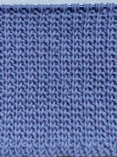 a blue knitted cloth is shown in close up