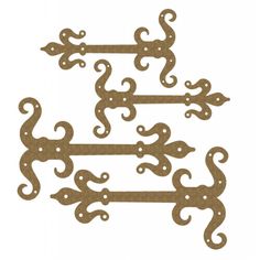 three metal brackets with decorative designs on them, one is brown and the other is white