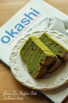 a piece of green cake on a plate with a fork and napkin next to it