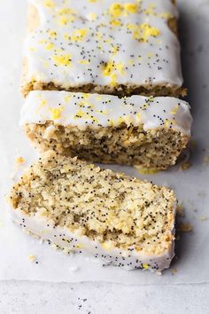 lemon poppy seed cake with white frosting and yellow sprinkles on top