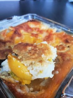 a casserole dish with peach cobbler in it