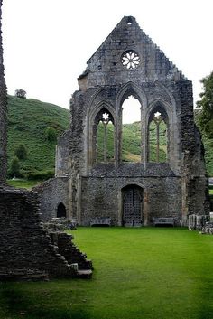 an old church with stone walls and windows