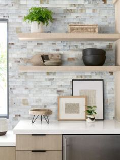 a kitchen with open shelving and shelves on the wall