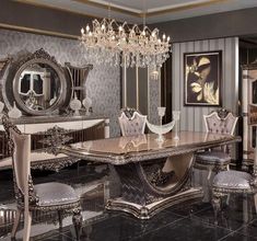 a fancy dining room set with chandelier and marble top table surrounded by chairs