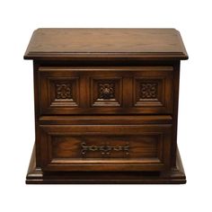 an old wooden chest with carvings on the front and sides, isolated against a white background