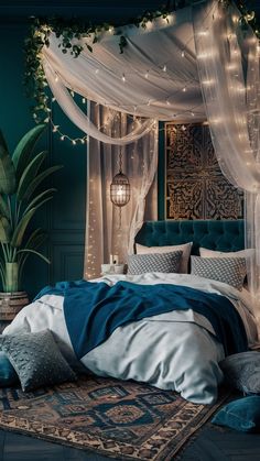 a bedroom decorated in teal and white with string lights on the headboard, bed canopy, and rug