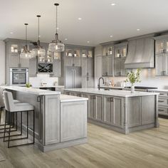 a large kitchen with gray cabinets and white counter tops