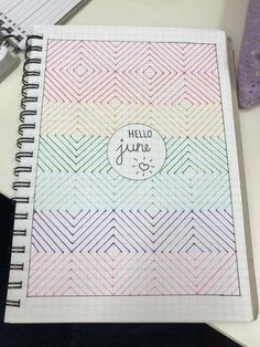 a notebook with the words hello june written on it