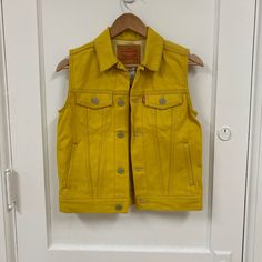 Nwt Levi’s Jean Vest. P2p 16.5” Never Worn Yellow Sleeveless Outerwear For Fall, Fitted Yellow Vest For Fall, Sleeveless Yellow Outerwear For Fall, Yellow Sleeveless Fall Outerwear, Fitted Levi's Cotton Outerwear, Classic Vest With Snap Buttons For Spring, Classic Spring Vest With Snap Buttons, Fitted Yellow Cotton Outerwear, Classic Fitted Yellow Outerwear