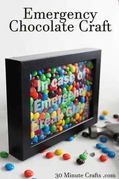 an emergency chocolate craft with colorful candies in it and the title overlay reads 30 minute crafts