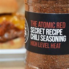 a jar of chili seasoning next to a hamburger