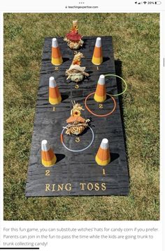 a cornhole toss game is shown on the grass with cones and orange cones around it