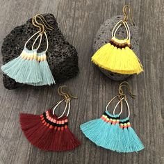 Fun light and easy to wear tassel earrings. Made with a teardrop brass base and unique mix of colorful tassels. You can choose from 4 different pairs that are in different colors. 4 unique pairs that will rock your day by day outfits. You can choose between the bright blue, light blue, yellow and burgundy. The earrings are 4.6cm- 1.90 inch long 3.6cm- 1.5 inch wide (where the tassels are) They have a drop length of 5.5cm- 2.25 inch A most have addition to your jewelry collection, To see more uni Bohemian Tassel Drop Earrings With Fringe, Bohemian Fringe Tassel Drop Earrings, Trendy Fringe Earrings For The Beach, Tassel Drop Earrings For Beach, Trendy Dangle Tassel Earrings For Festivals, Trendy Tassel Dangle Earrings For Festival, Trendy Fringe Drop Earrings, Fringe Drop Tassel Earrings As Gift, Fringe Tassel Drop Earrings As Gift