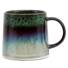 a black and green coffee mug on a white background, with blue speckles